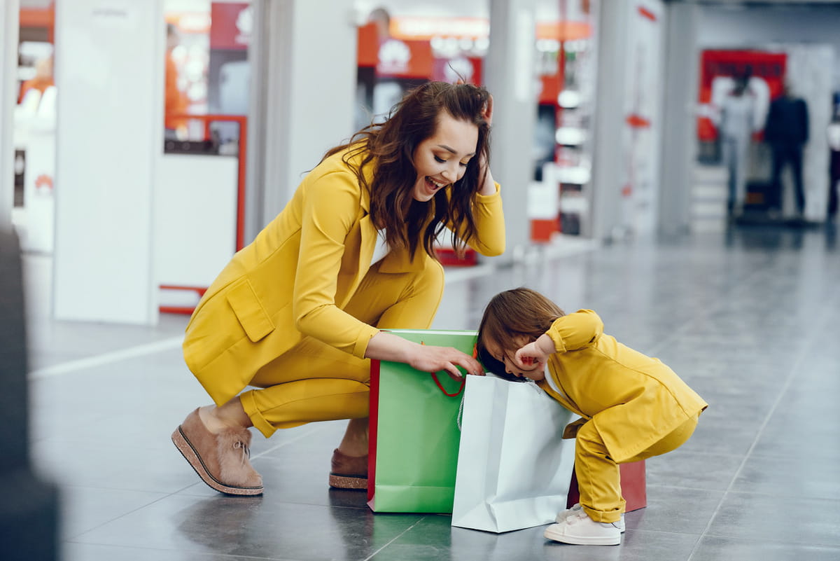 Mother daughter with shopping bag